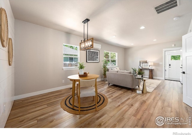 217 Locust St, Windsor, CO 80550 - dining room with light wood finished floors, a chandelier, baseboards, and recessed lighting