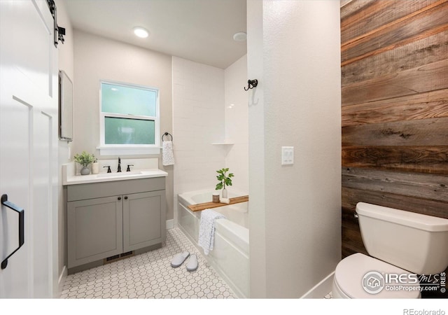 217 Locust St, Windsor, CO 80550 - bathroom featuring vanity, toilet, bathing tub / shower combination, and baseboards
