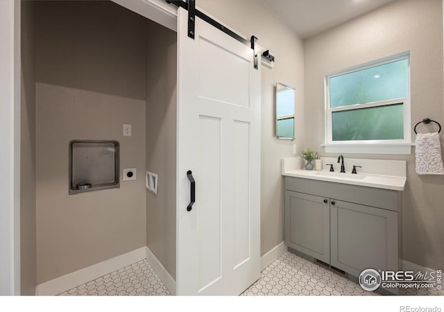 217 Locust St, Windsor, CO 80550 - bathroom featuring vanity, baseboards, and tile patterned floors