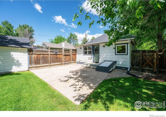 217 Locust St, Windsor, CO 80550 - rear view of property featuring a patio area and an outdoor structure
