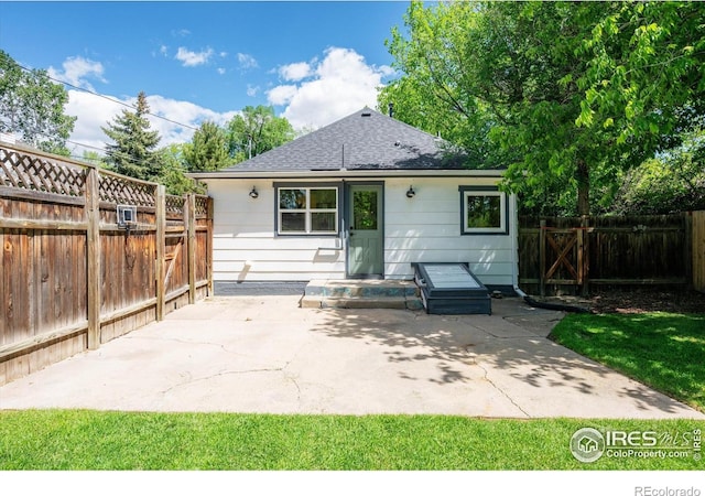 217 Locust St, Windsor, CO 80550 - rear view of property with a patio area and a shingled roof
