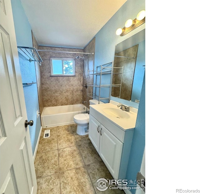 2614 Willard Dr, Colorado Springs, CO 80911 - full bathroom featuring washtub / shower combination, vanity, tile patterned floors, toilet, and a textured ceiling