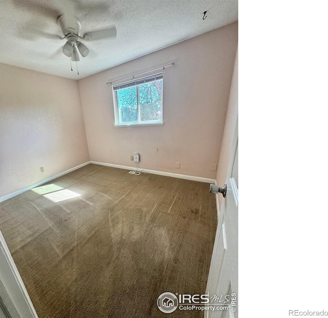 2614 Willard Dr, Colorado Springs, CO 80911 - carpeted spare room with baseboards, a ceiling fan, and a textured ceiling