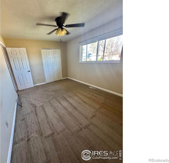 2614 Willard Dr, Colorado Springs, CO 80911 - unfurnished bedroom featuring a textured ceiling, baseboards, a closet, and ceiling fan