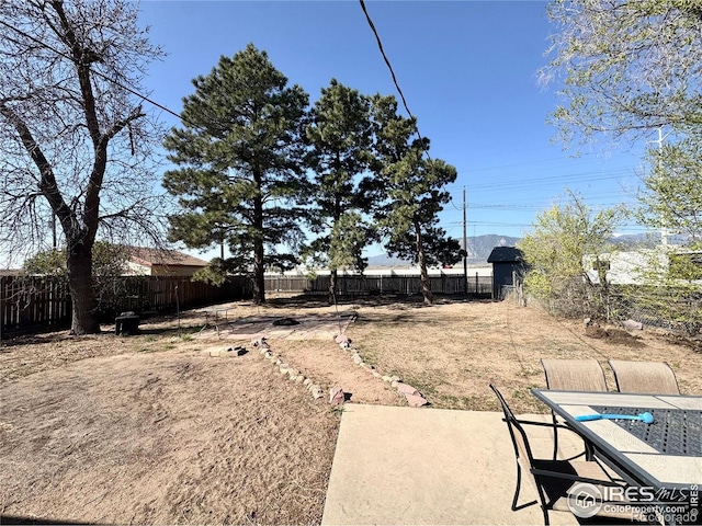 2614 Willard Dr, Colorado Springs, CO 80911 - fenced backyard with a patio and outdoor dining space