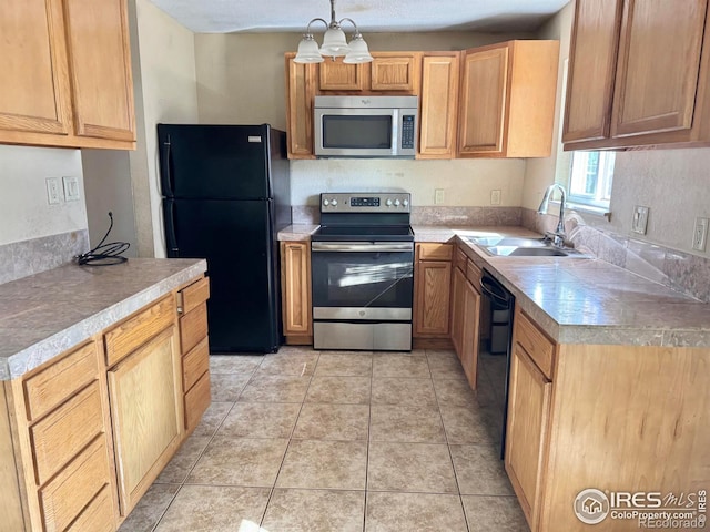 2614 Willard Dr, Colorado Springs, CO 80911 - kitchen featuring black appliances, a sink, light countertops, hanging light fixtures, and a chandelier