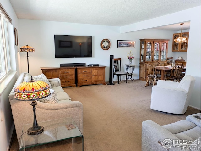 1545 S Vivian St, Longmont, CO 80501 - living room with a chandelier and light colored carpet
