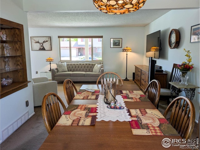 1545 S Vivian St, Longmont, CO 80501 - dining room featuring a textured ceiling