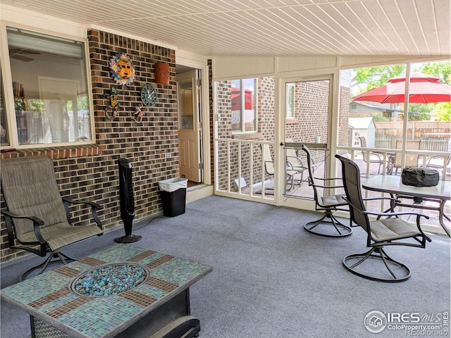 1545 S Vivian St, Longmont, CO 80501 - sunroom / solarium featuring carpet floors and wooden ceiling