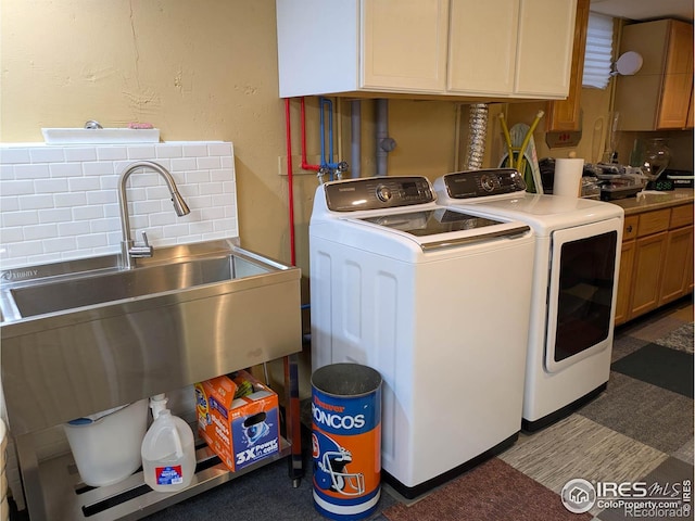 1545 S Vivian St, Longmont, CO 80501 - laundry room featuring cabinet space, washing machine and dryer, and tile patterned floors