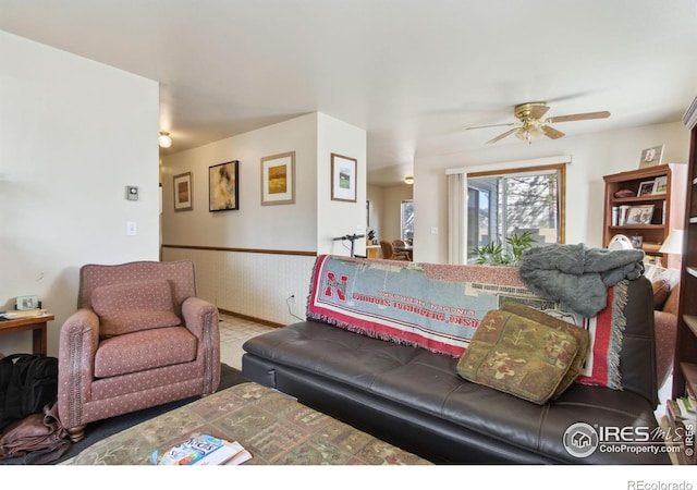 3465 Lochwood Dr Unit N62, Fort Collins, CO 80525 - living area with wainscoting and a ceiling fan