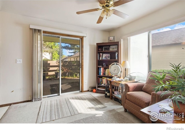 3465 Lochwood Dr Unit N62, Fort Collins, CO 80525 - living area featuring carpet, baseboards, and a ceiling fan