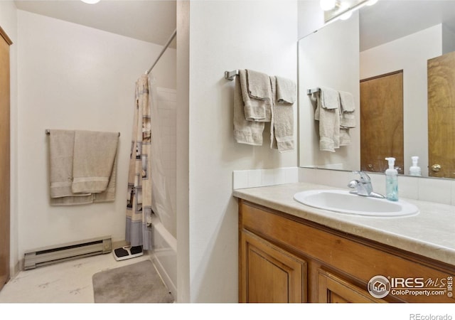 3465 Lochwood Dr Unit N62, Fort Collins, CO 80525 - full bathroom featuring a baseboard radiator, vanity, and shower / tub combo with curtain