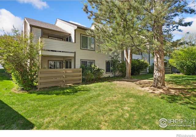 3465 Lochwood Dr Unit N62, Fort Collins, CO 80525 - back of property featuring a lawn