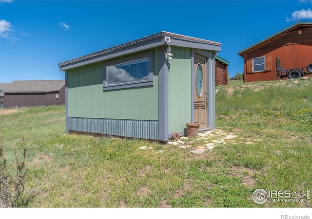 519 Palisade Mountain Dr, Drake, CO 80515 - view of property exterior with a lawn and an outbuilding