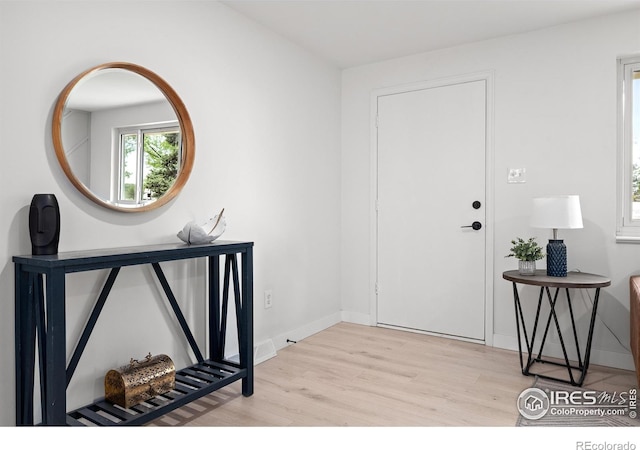 5329 Flower Cir, Arvada, CO 80002 - entryway featuring wood finished floors and baseboards