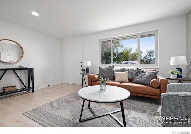 5329 Flower Cir, Arvada, CO 80002 - living area featuring light wood-style floors, recessed lighting, and baseboards