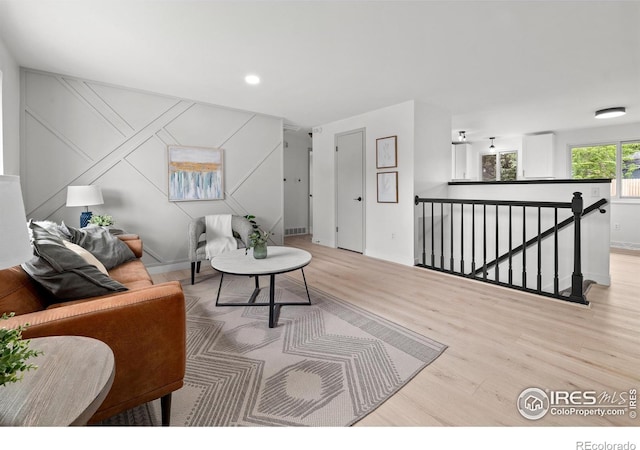 5329 Flower Cir, Arvada, CO 80002 - living room featuring wood finished floors, baseboards, and recessed lighting