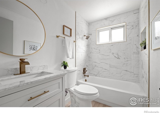 5329 Flower Cir, Arvada, CO 80002 - full bathroom with vanity, toilet, and bathing tub / shower combination