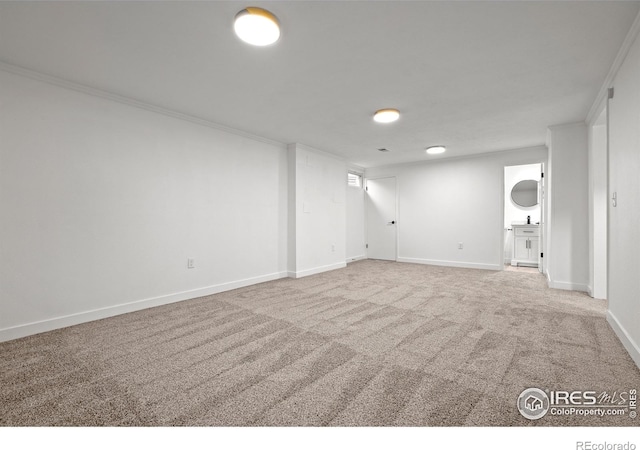 5329 Flower Cir, Arvada, CO 80002 - finished below grade area with ornamental molding, carpet, baseboards, and a sink