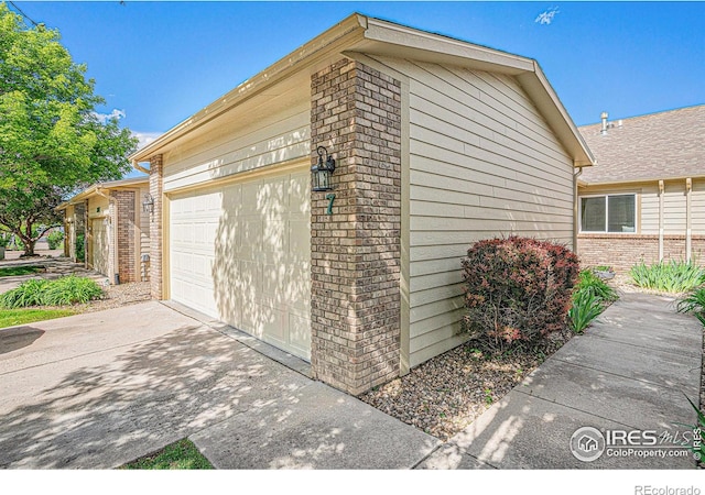 3525 Auntie Stone St Unit 7, Fort Collins, CO 80526 - garage featuring driveway