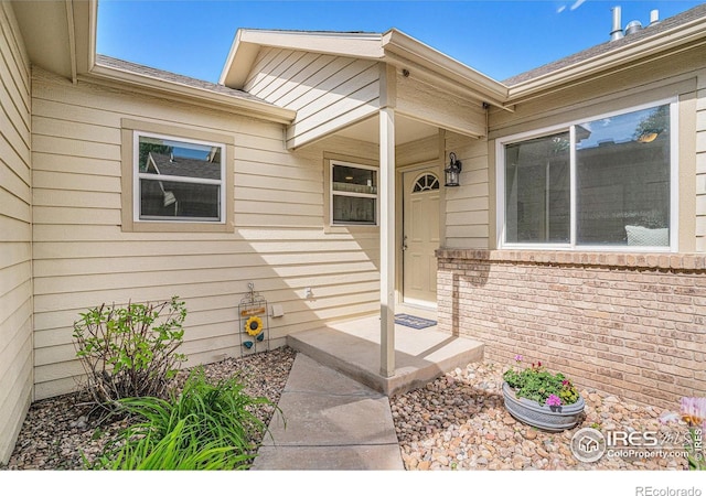 3525 Auntie Stone St Unit 7, Fort Collins, CO 80526 - doorway to property with brick siding