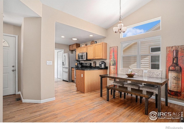 3525 Auntie Stone St Unit 7, Fort Collins, CO 80526 - dining room featuring light wood-style floors, a chandelier, vaulted ceiling, baseboards, and recessed lighting