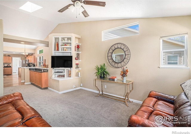3525 Auntie Stone St Unit 7, Fort Collins, CO 80526 - living area with vaulted ceiling, ceiling fan, baseboards, light carpet, and a skylight