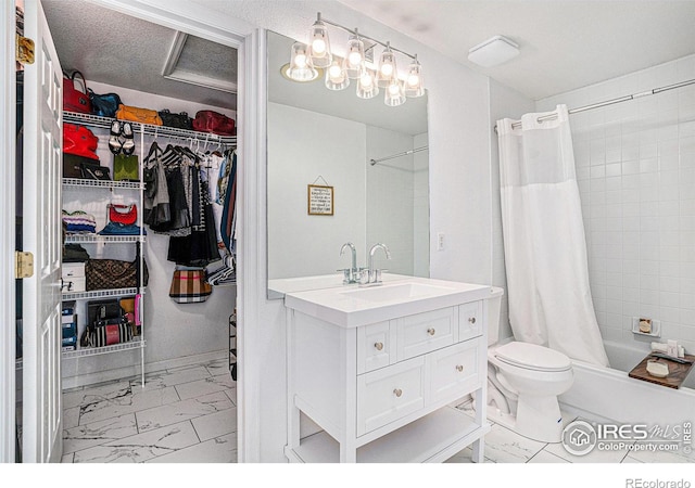 3525 Auntie Stone St Unit 7, Fort Collins, CO 80526 - full bath featuring marble look tiles, vanity, toilet, shower / bath combo with shower curtain, and a walk in closet