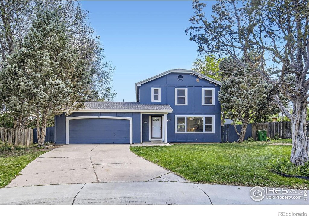 624 Hanna St, Fort Collins, CO 80521 - traditional-style home featuring a garage and driveway