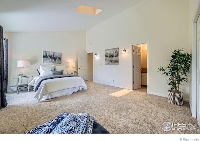 2977 Eagle Way, Boulder, CO 80301 - carpeted bedroom with high vaulted ceiling, a skylight, and baseboards