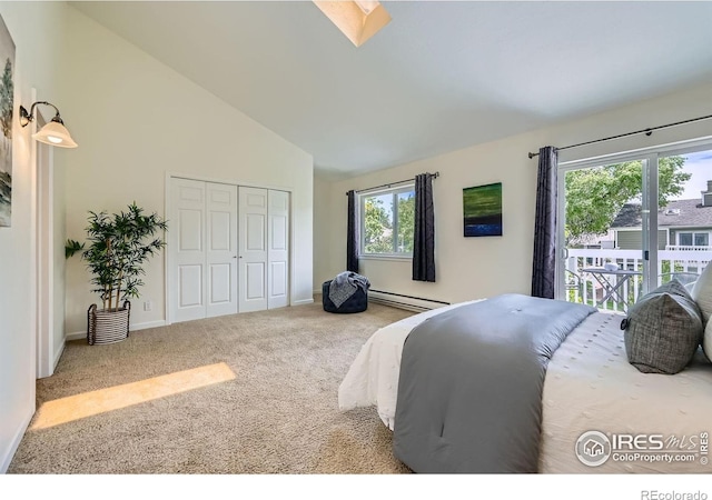 2977 Eagle Way, Boulder, CO 80301 - carpeted bedroom with a baseboard heating unit, multiple windows, a closet, access to exterior, and high vaulted ceiling