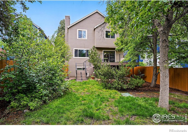 4489 Wellington Rd, Boulder, CO 80301 - rear view of property featuring stairway and a chimney