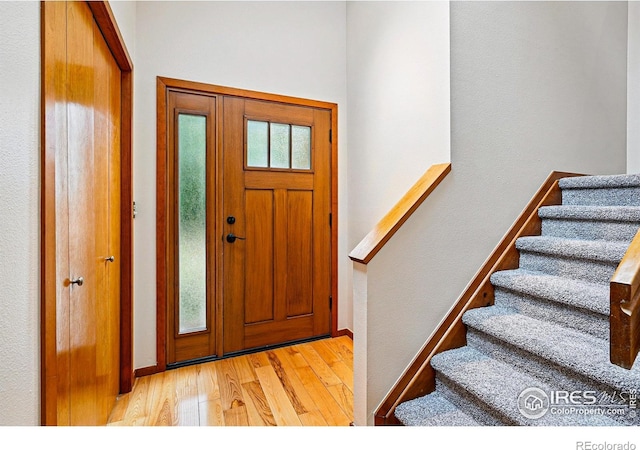 4489 Wellington Rd, Boulder, CO 80301 - entryway featuring light wood-type flooring, stairway, and baseboards