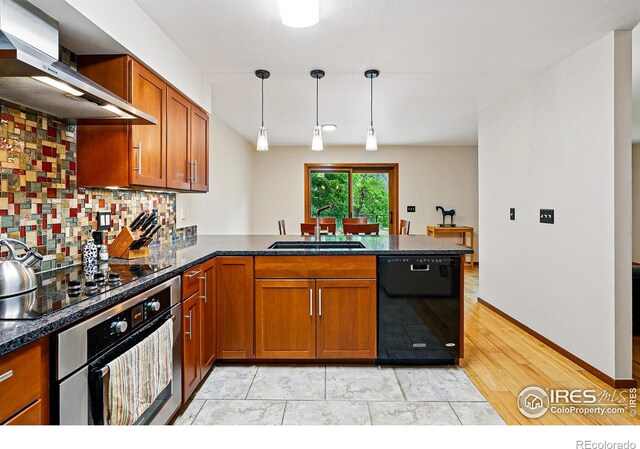 4489 Wellington Rd, Boulder, CO 80301 - kitchen featuring black appliances, a sink, ventilation hood, a peninsula, and brown cabinetry