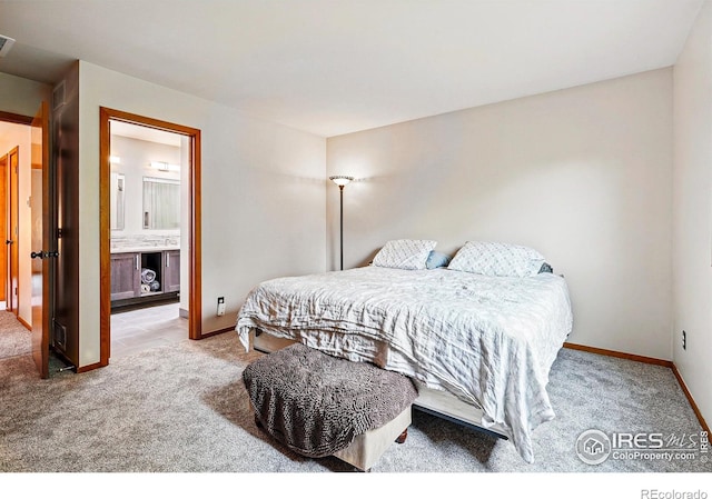 4489 Wellington Rd, Boulder, CO 80301 - bedroom with light carpet, baseboards, and ensuite bathroom