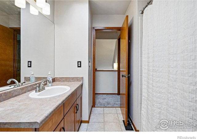 4489 Wellington Rd, Boulder, CO 80301 - full bathroom with vanity, baseboards, and a shower with curtain