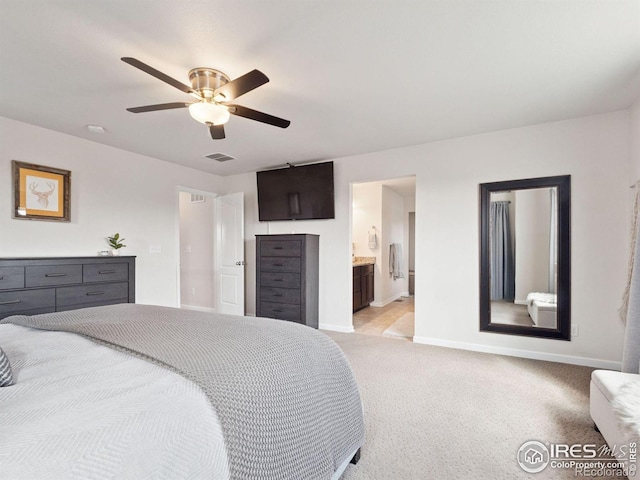 610 Sun Up Pl, Erie, CO 80516 - bedroom featuring baseboards, light carpet, ceiling fan, and ensuite bath
