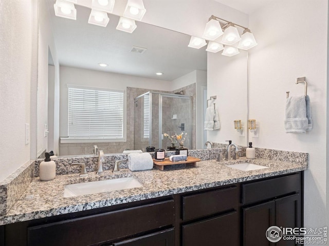 610 Sun Up Pl, Erie, CO 80516 - bathroom with double vanity and a shower stall
