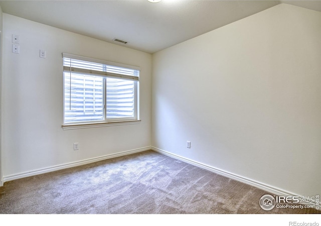 1240 Wren Ct Unit B, Longmont, CO 80501 - carpeted spare room featuring baseboards and lofted ceiling