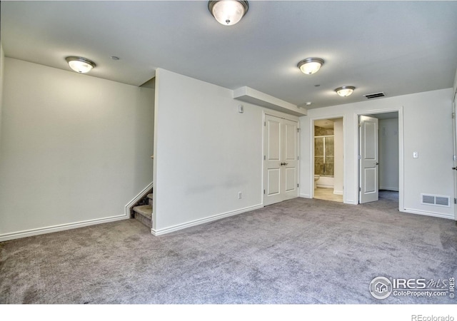 1240 Wren Ct Unit B, Longmont, CO 80501 - unfurnished bedroom with carpet floors, baseboards, and connected bathroom