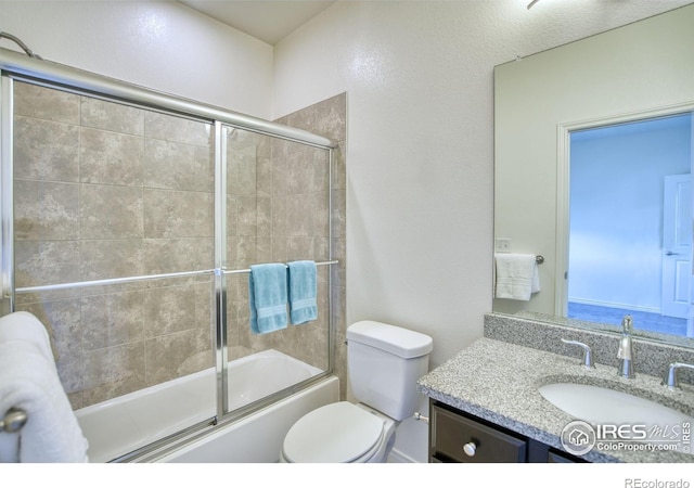 1240 Wren Ct Unit B, Longmont, CO 80501 - bathroom with vanity, toilet, and enclosed tub / shower combo