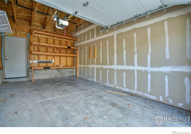 1240 Wren Ct Unit B, Longmont, CO 80501 - garage featuring a garage door opener
