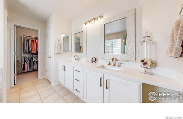 2139 Andrews St, Fort Collins, CO 80528 - full bathroom with double vanity, tile patterned flooring, and a walk in closet