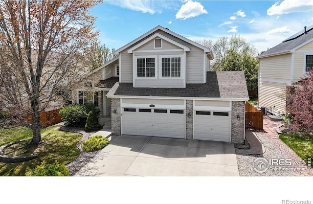 2139 Andrews St, Fort Collins, CO 80528 - traditional home featuring driveway, brick siding, roof with shingles, and an attached garage