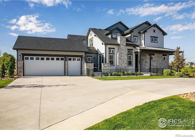 4268 Ardglass Ln, Timnath, CO 80547 - modern farmhouse style home featuring stone siding, concrete driveway, an attached garage, and board and batten siding
