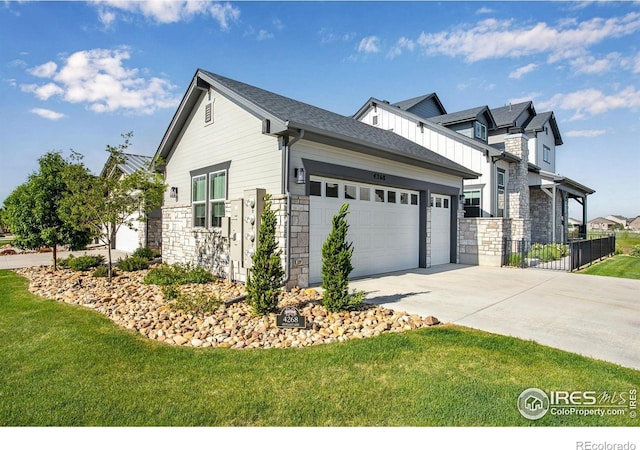 4268 Ardglass Ln, Timnath, CO 80547 - view of side of property featuring stone siding, a garage, and concrete driveway
