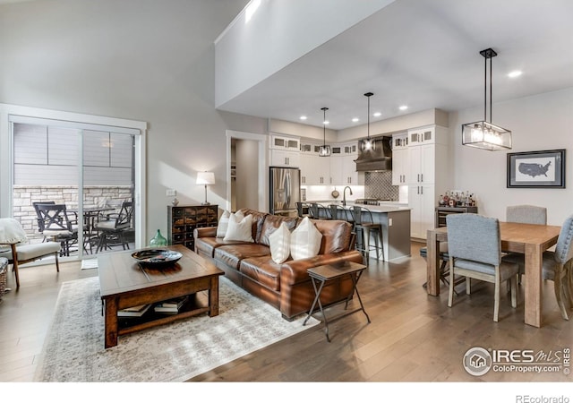 4268 Ardglass Ln, Timnath, CO 80547 - living room featuring wood finished floors and recessed lighting