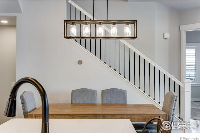 4268 Ardglass Ln, Timnath, CO 80547 - carpeted dining room featuring stairs