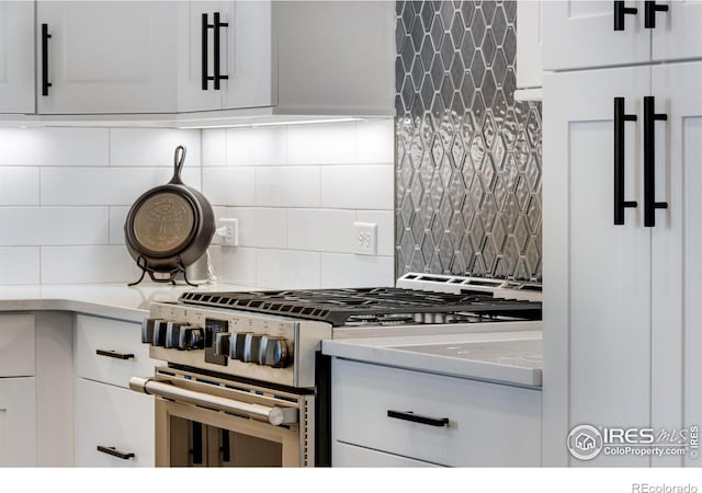 4268 Ardglass Ln, Timnath, CO 80547 - kitchen with gas range, tasteful backsplash, white cabinetry, and light countertops